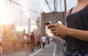 Woman looking at phone in NY